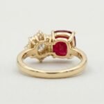 Cushion cut natural ruby and asymmetric diamond cluster ring in 18k yellow gold by RatnaShakti Gems and Jewelry.