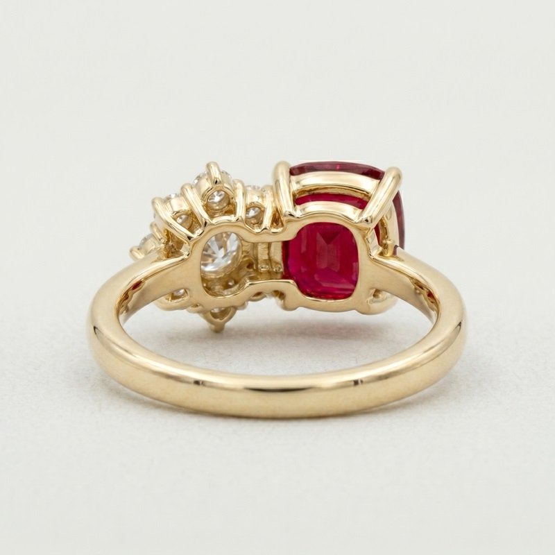 Cushion cut natural ruby and asymmetric diamond cluster ring in 18k yellow gold by RatnaShakti Gems and Jewelry.