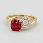 Cushion cut natural ruby and asymmetric diamond cluster ring in 18k yellow gold by RatnaShakti Gems and Jewelry.