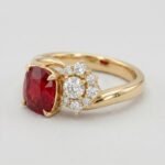 Cushion cut natural ruby and asymmetric diamond cluster ring in 18k yellow gold by RatnaShakti Gems and Jewelry.